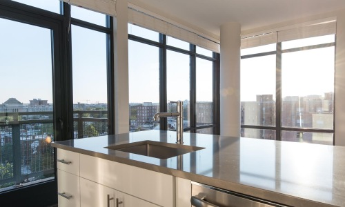 a kitchen with large windows