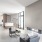 a modern living room with a large glass wall