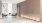 a room with a wood wall and chairs