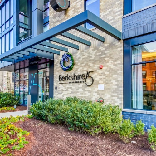 The essence of exceptional living a building with a sign on the front