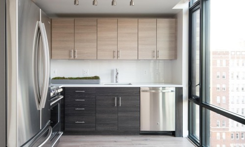 a kitchen with wooden cabinets