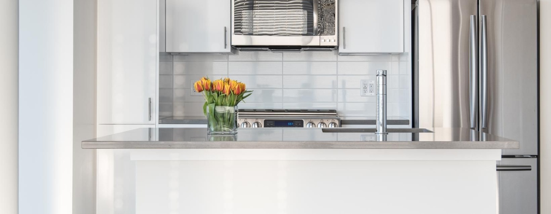 a kitchen with white cabinets
