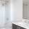 a bathroom with a tub sink and toilet