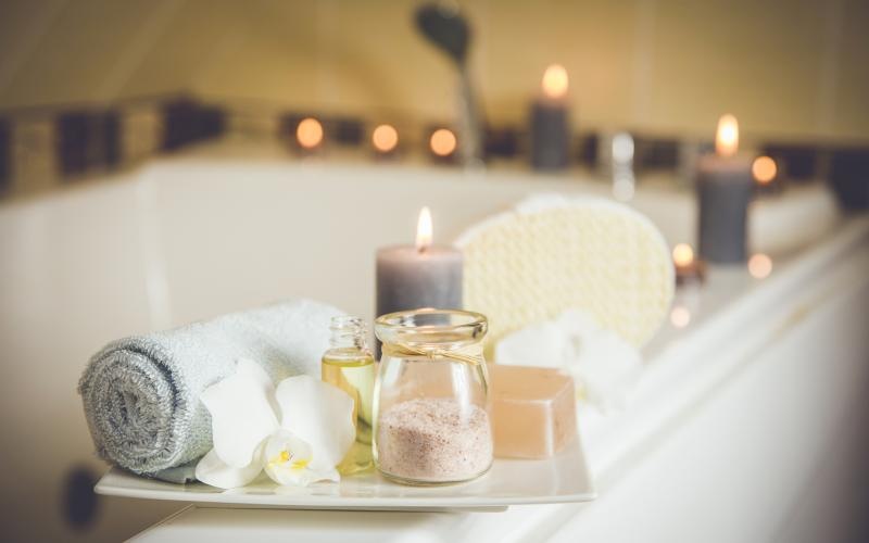 a tray with candles and a group of candles on it